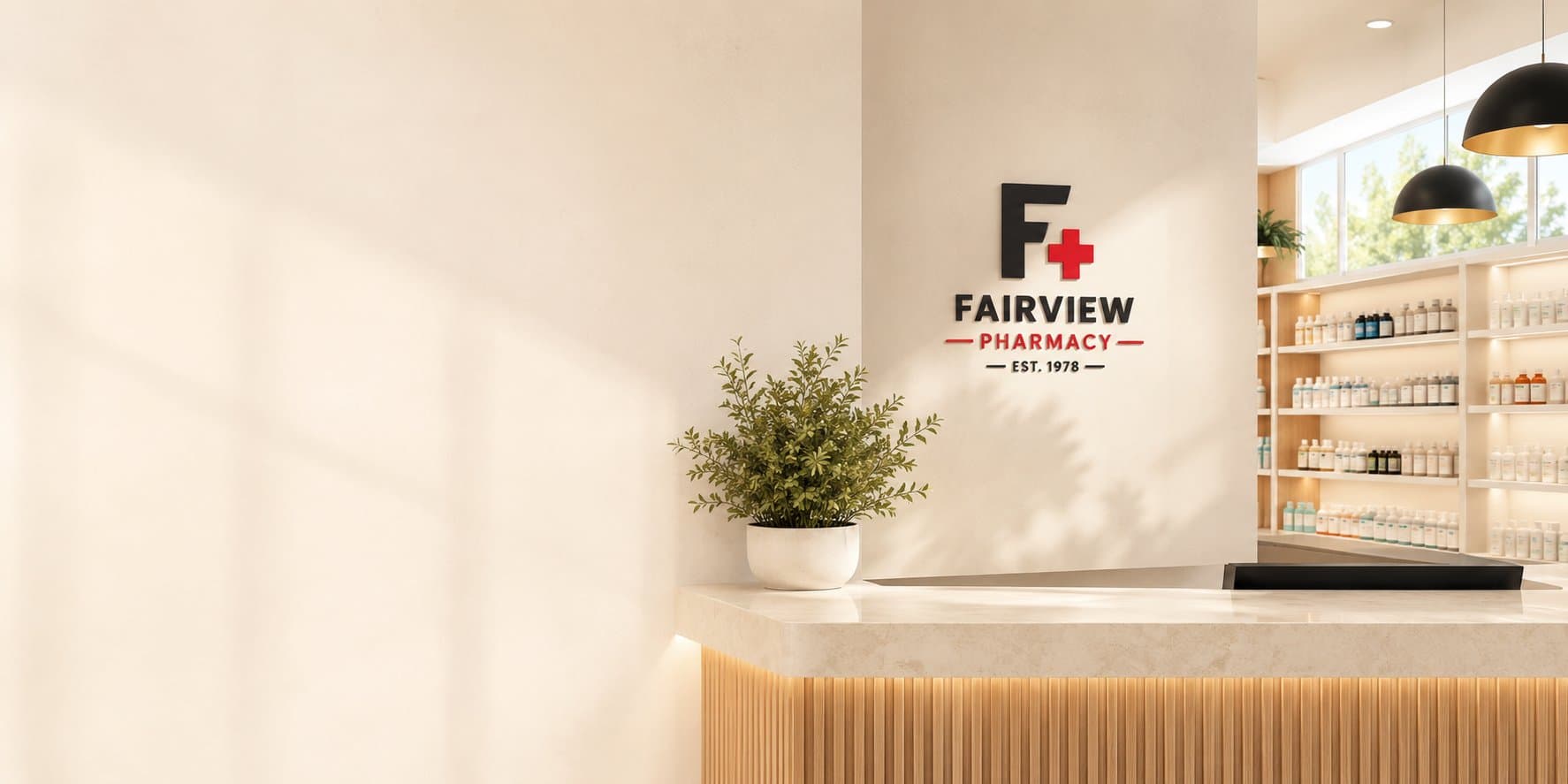 Fairview Pharmacy interior view: clean cream counter with potted plant under the F+ Fairview Pharmacy logo, wood paneling, soft natural light, wellness shelves to the right